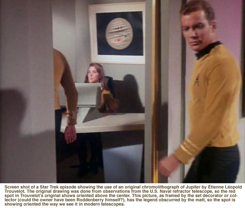 Screen shot of a Star Trek episode showing the use of an original chromolithograph of Jupiter by &Eacute;tienne L&eacute;opold Trouvelot. The original drawing was done from observations from the U.S. Naval refractor telescope, so the red spot in Trouvelot’s original shows oriented above the center. This picture, as framed by the set decorator or collector (could the owner have been Roddenberry himself?), has the legend obscurred by the matt, so the spot is showing oriented the way we see it in modern telescopes.
